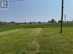 Open land beside. No neighbours. City maintains -