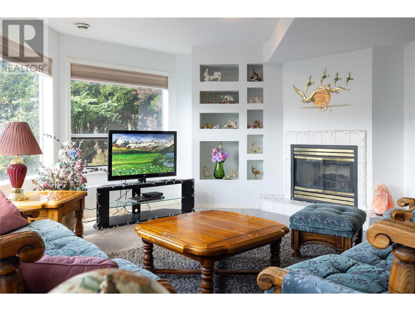 8827 Michael Drive, Coldstream, BC - Indoor Photo Showing Living Room With Fireplace