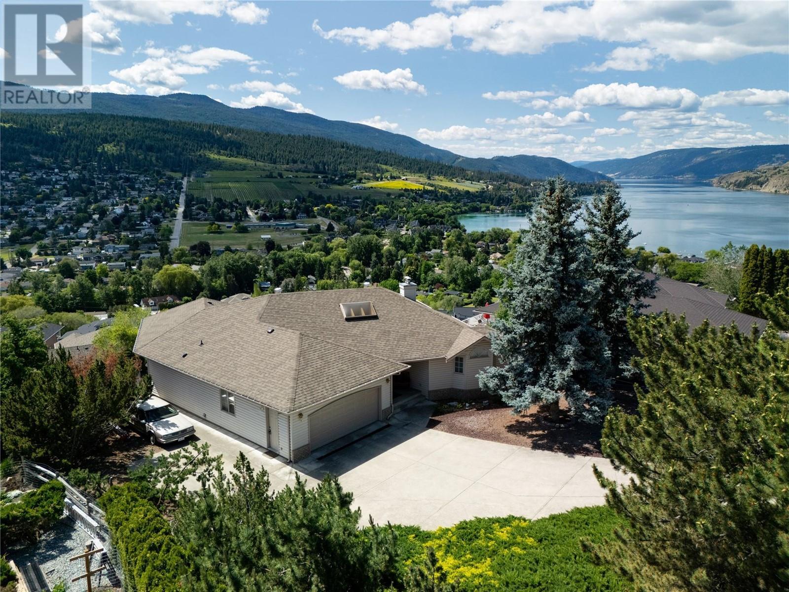This is Coldstream living! - 8827 Michael Drive, Coldstream, BC - Outdoor With Body Of Water With View