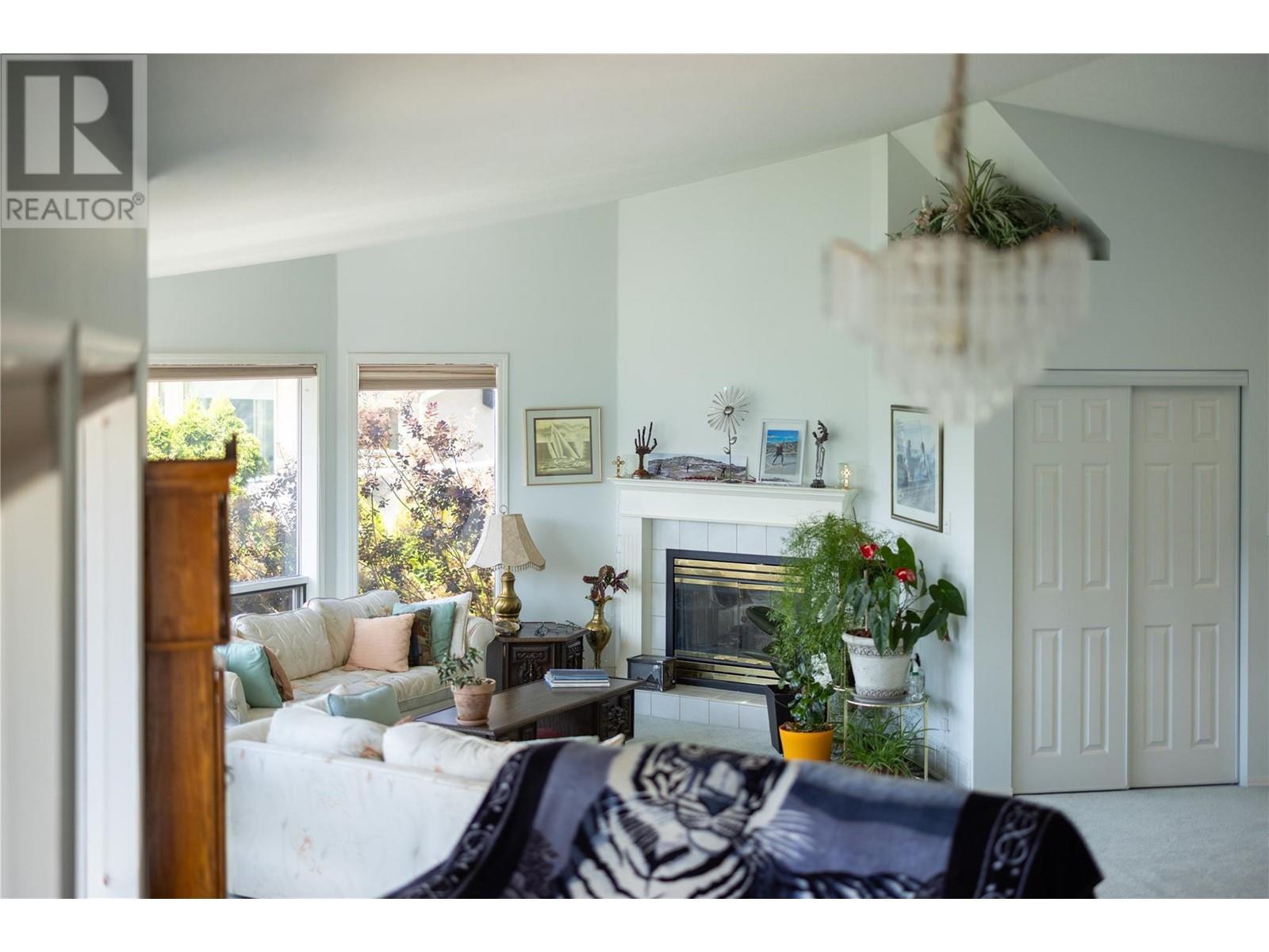 8827 Michael Drive, Coldstream, BC - Indoor Photo Showing Living Room With Fireplace