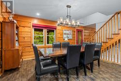 Stunning dining area log wood walls -