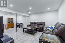 Family room with LED pot lights. -