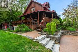 Including coloured concrete drive & stone stair -