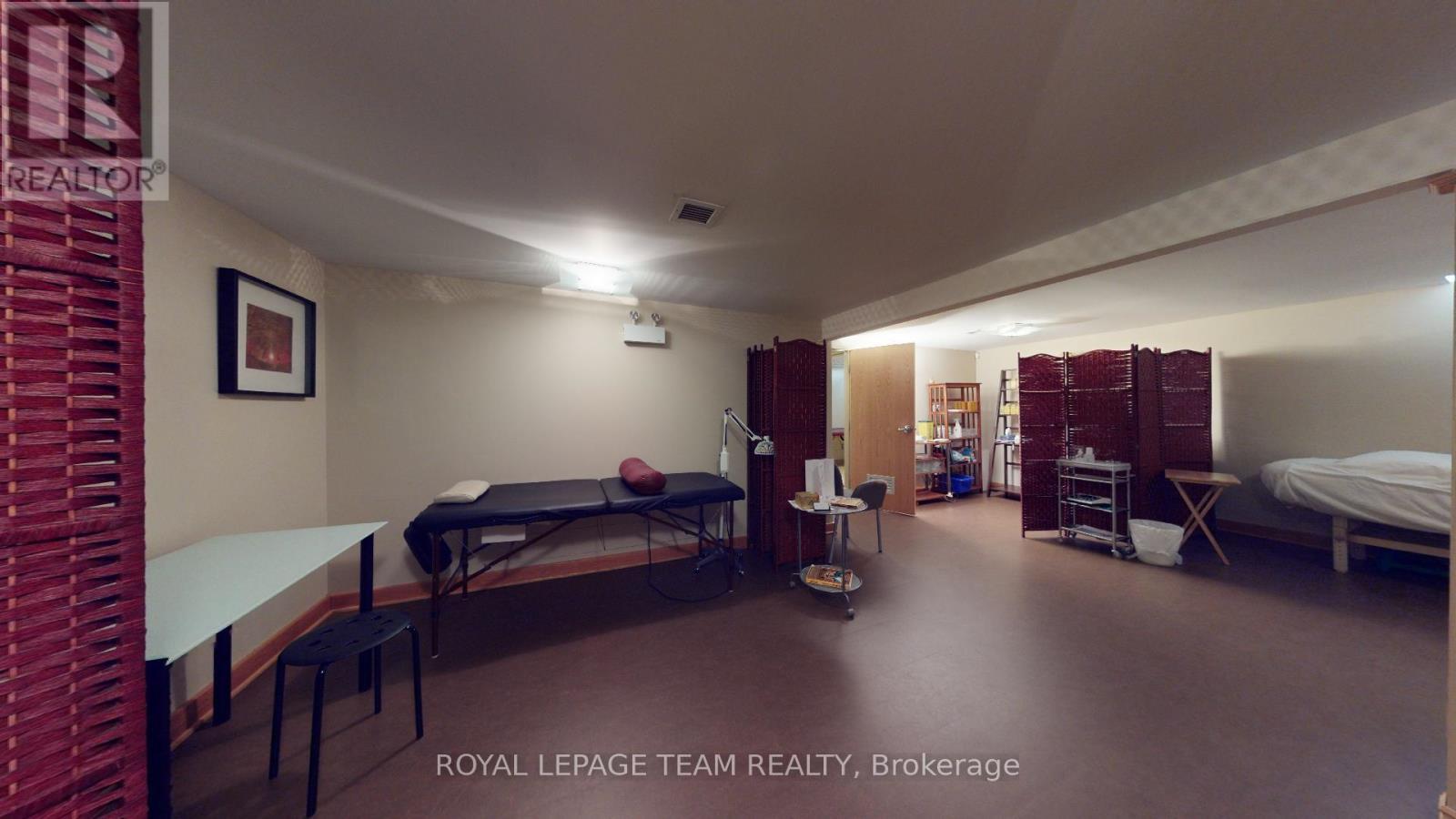 Finished open area within lower level - 942 Merivale Road, Ottawa, ON