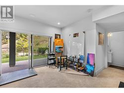 Lower level rec room with access to yard. -