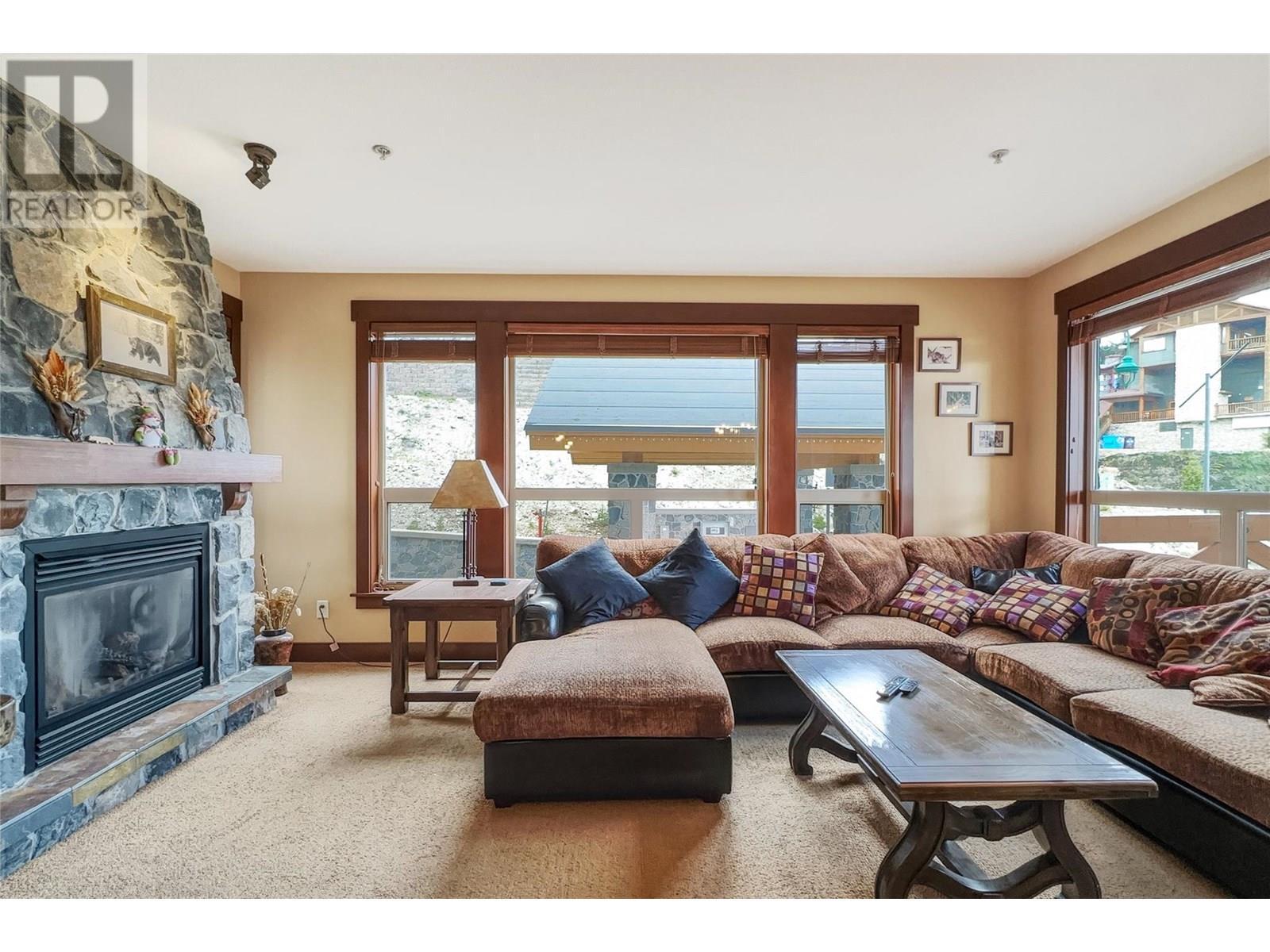 375 Raven Ridge Road Unit# 101C, Big White, BC - Indoor Photo Showing Living Room With Fireplace