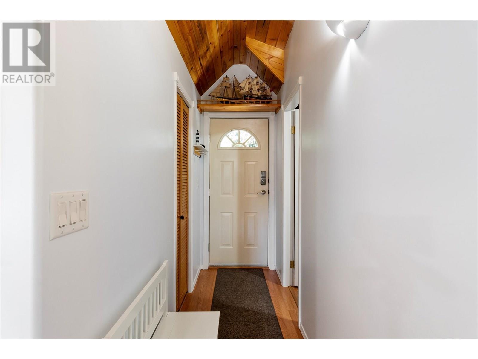 Carriage house entry - 1047 Wharf Road, Scotch Creek, BC - Indoor Photo Showing Other Room
