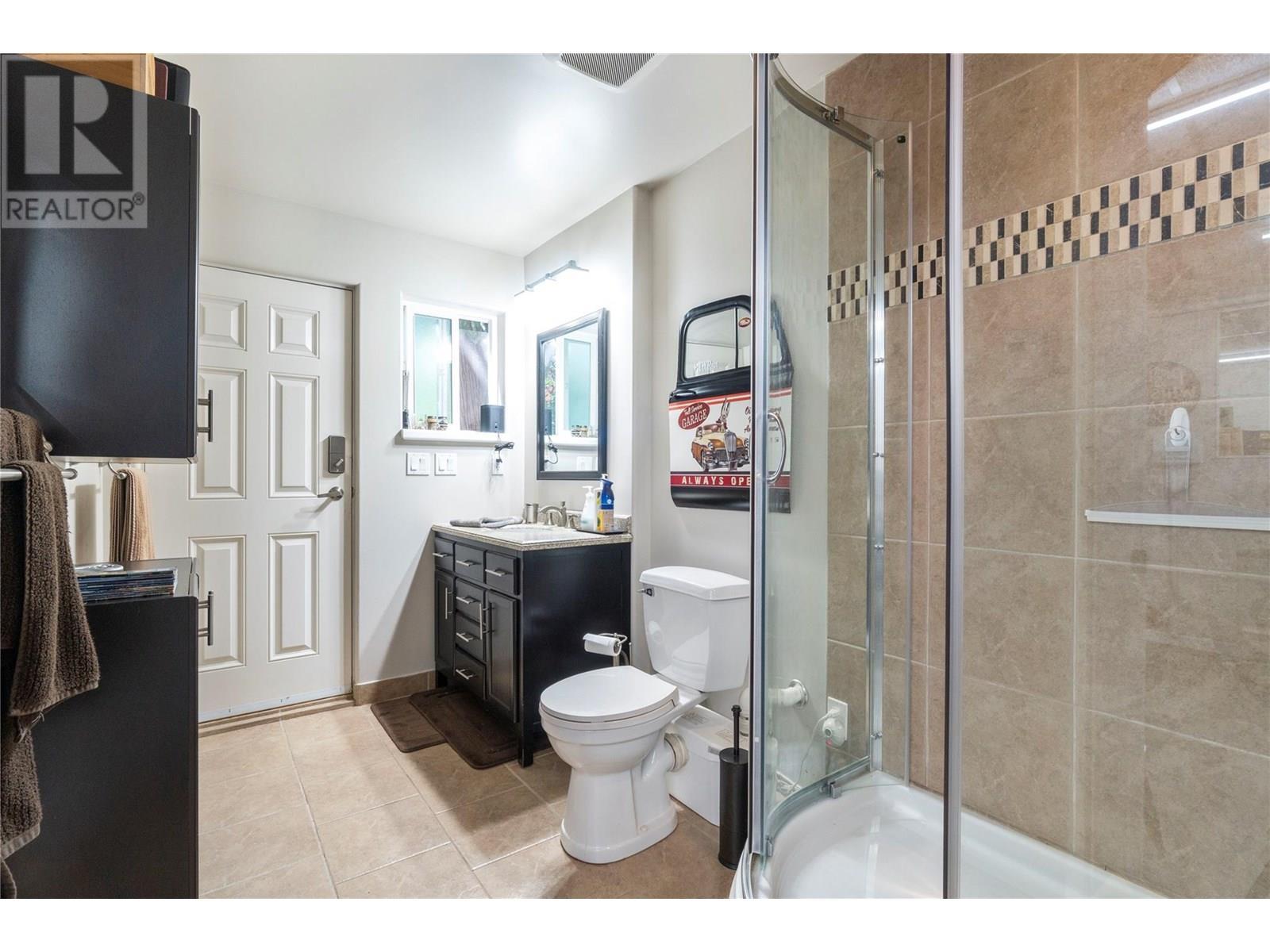 3 Piece bath in garage - 1047 Wharf Road, Scotch Creek, BC - Indoor Photo Showing Bathroom