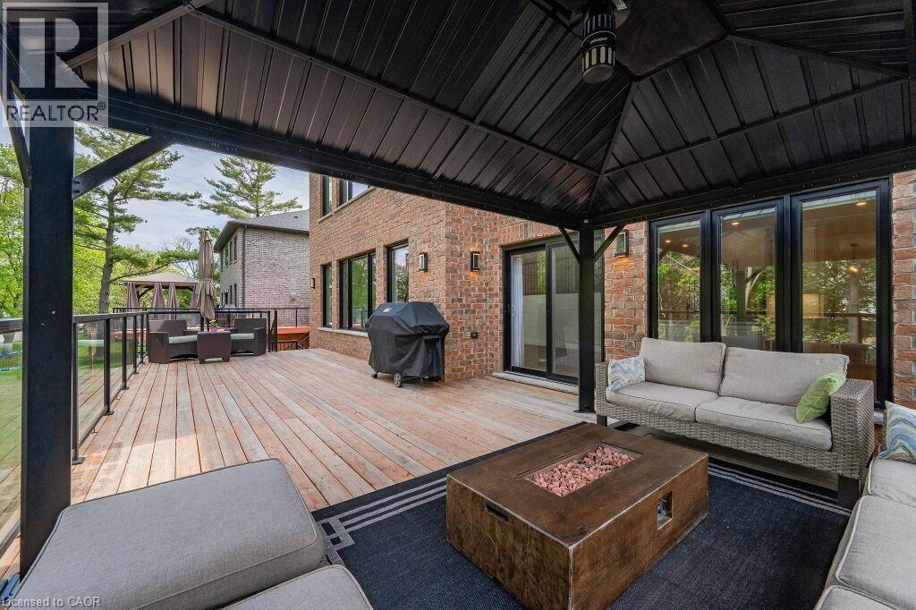 Wooden deck featuring a gazebo, an outdoor living space with a fire pit, and a grill - 346 Lexington Road, Waterloo, ON - Outdoor With Deck Patio Veranda With Exterior