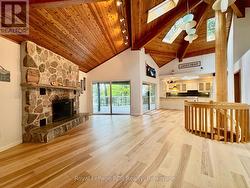 Enter into open concept, vaulted ceiling space. -