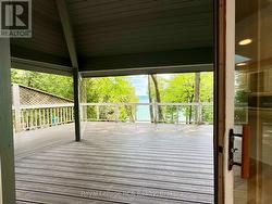 With walkout to covered deck and water views. -