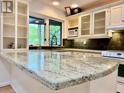 Breakfast island for entertaining & casual dining. -