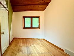 3rd main floor bedroom with vaulted ceiling. -