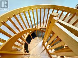 Custom spiral staircase to lower level walkout. -