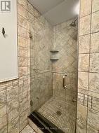 With built-in shower & glass door system. -
