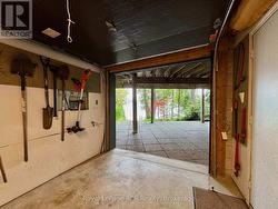 With insulated overhead door to waterside patio. -
