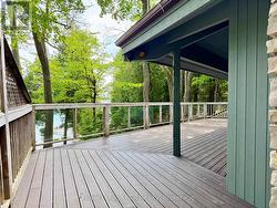 Elevated composite deck with glass railings. -
