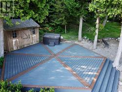 Custom hexagon shoreside deck, cabana & hot tub. -