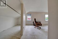 Primary Bdrm with 2 Windows overlooking frontyard -