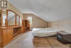 Bedroom 3 with window overlooking backyard -