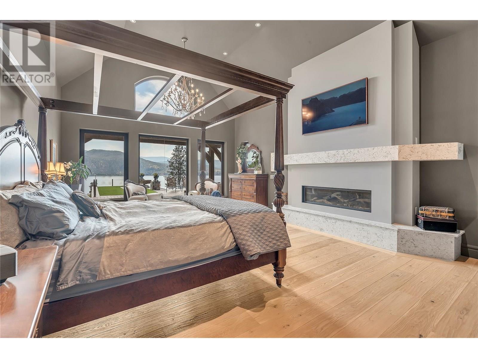 2119 Naramata Road, Naramata, BC - Indoor Photo Showing Bedroom With Fireplace