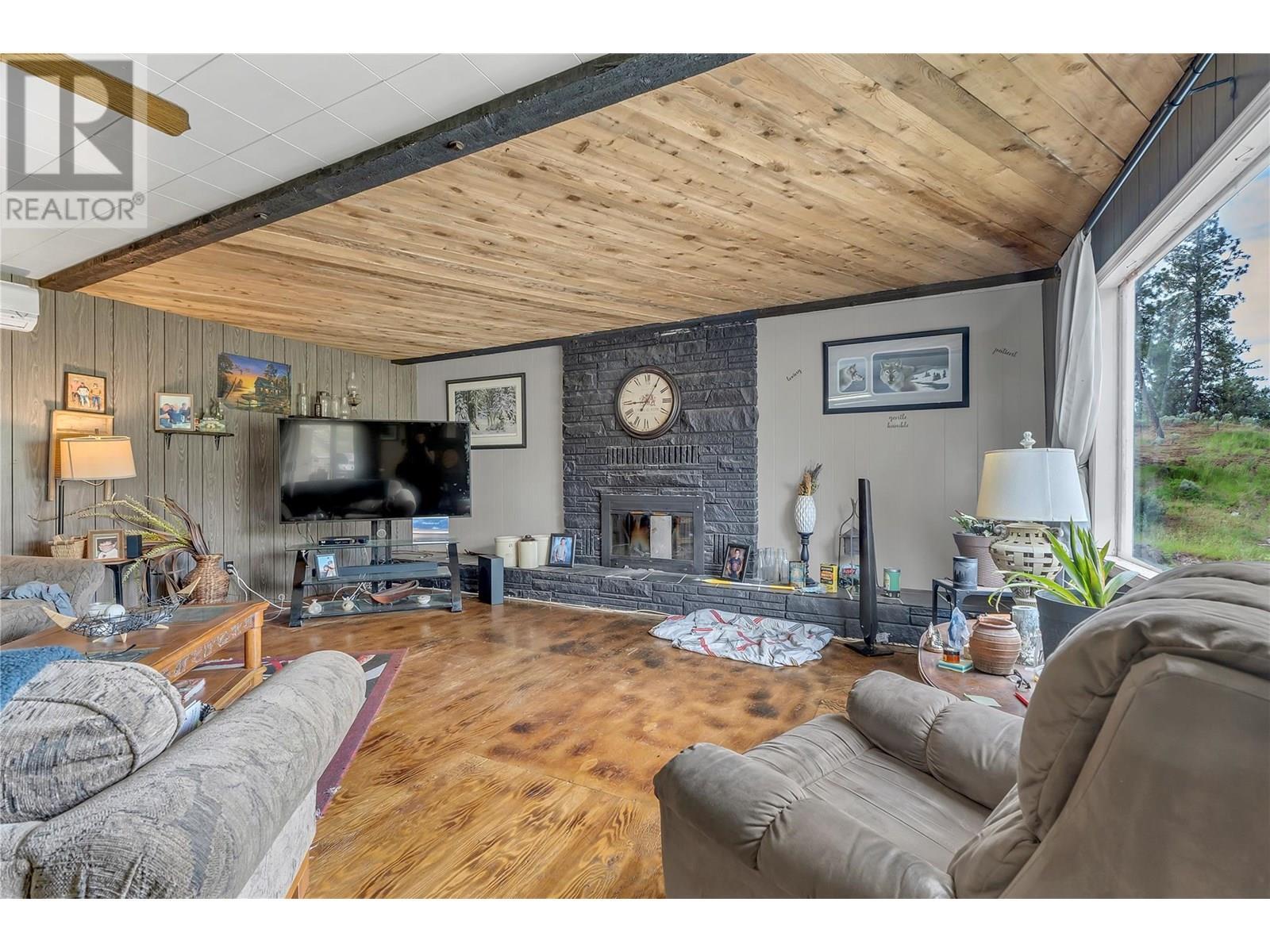 3803 Mclean Creek Road, Okanagan Falls, BC - Indoor Photo Showing Living Room With Fireplace