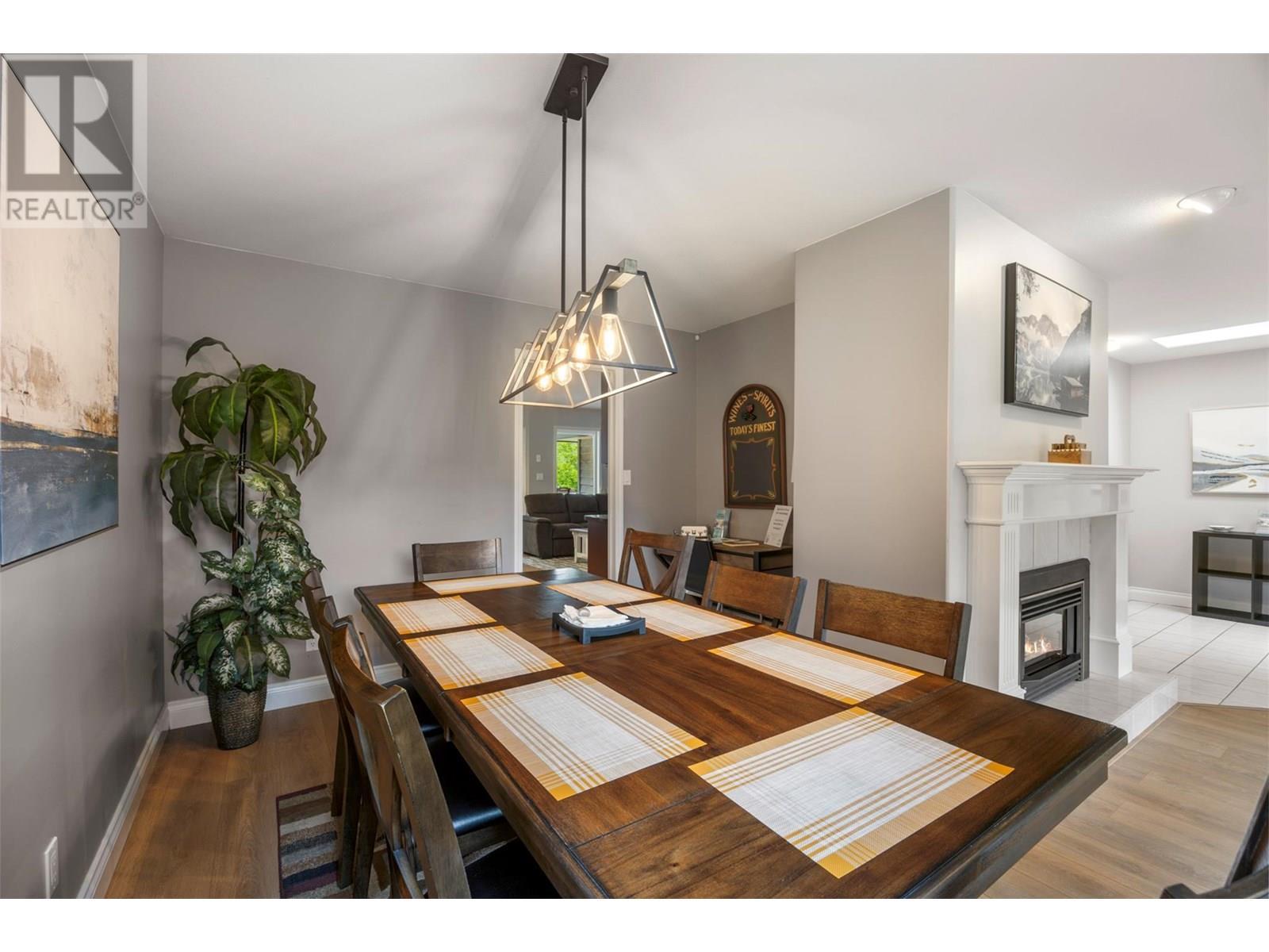 3789 Zinck Road, Scotch Creek, BC - Indoor Photo Showing Dining Room With Fireplace