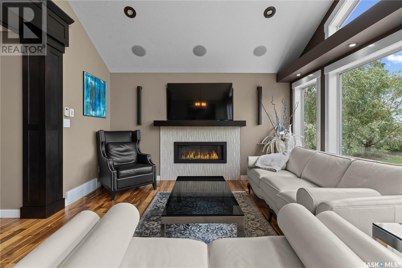 4818 Sandpiper Crescent E, Regina, SK - Indoor Photo Showing Living Room With Fireplace