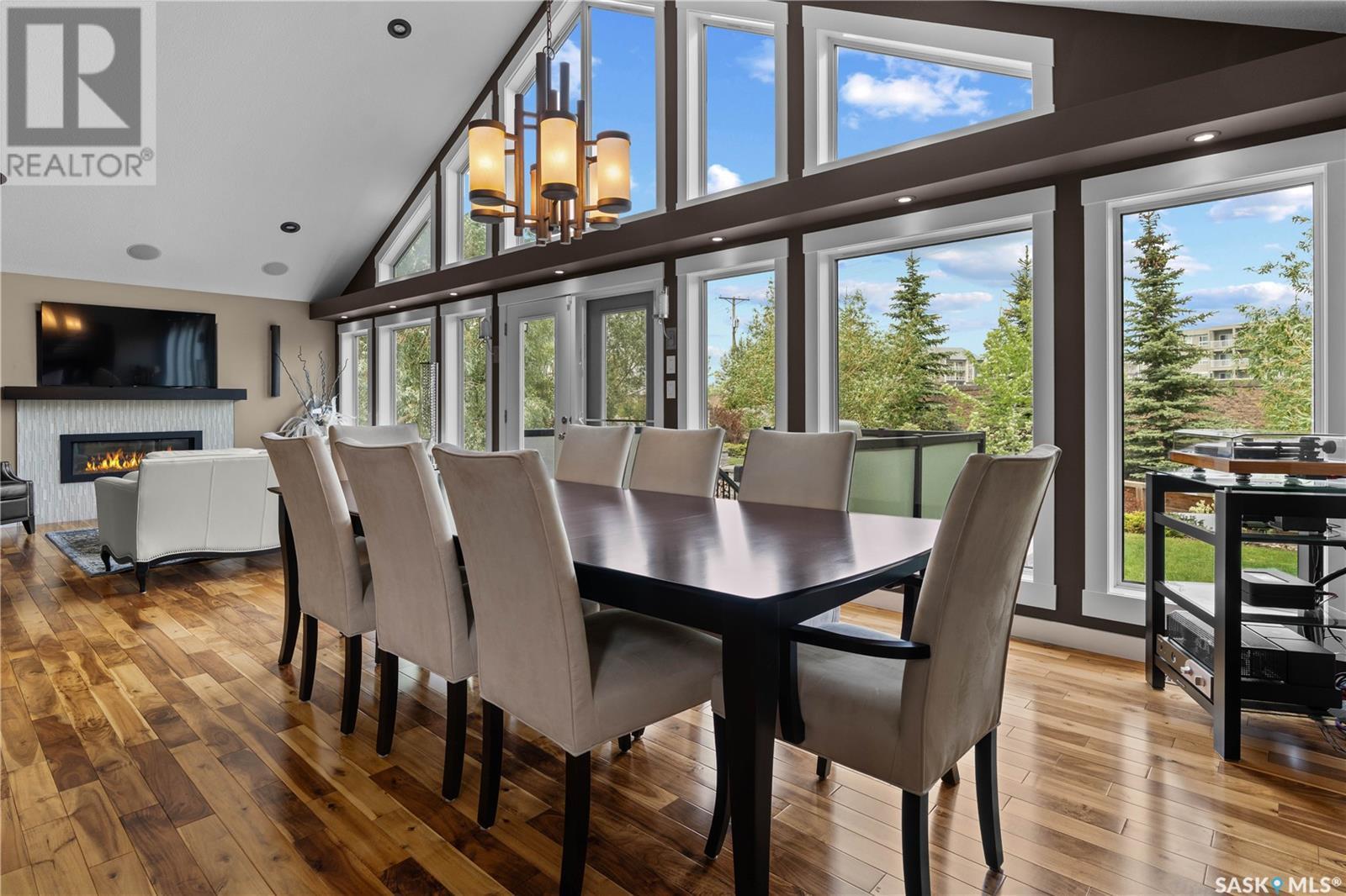 4818 Sandpiper Crescent E, Regina, SK - Indoor Photo Showing Dining Room With Fireplace