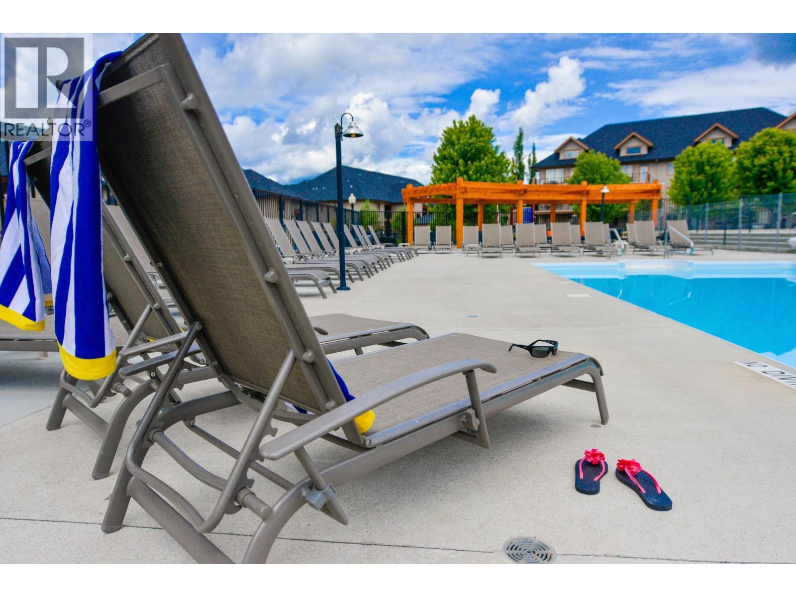 800 Bighorn Boulevard Unit# 825 E, Radium Hot Springs, BC - Outdoor With In Ground Pool
