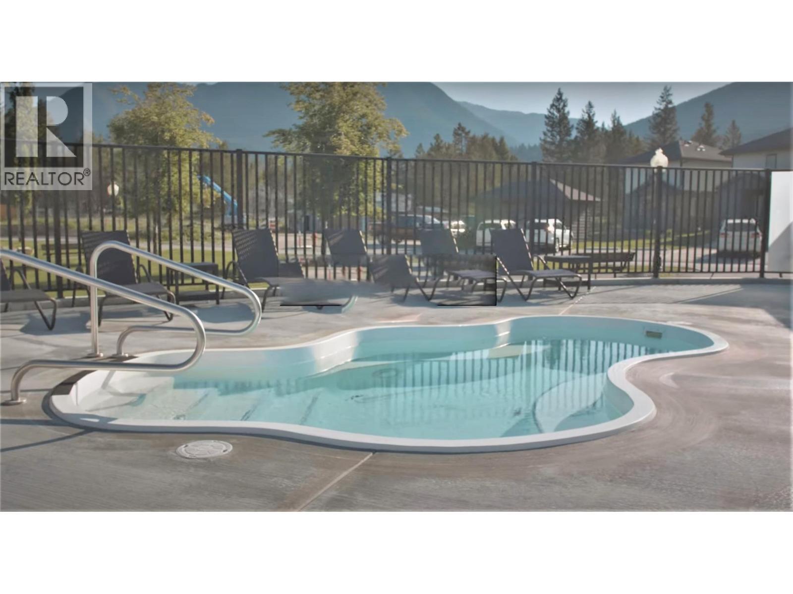 800 Bighorn Boulevard Unit# 825 E, Radium Hot Springs, BC - Outdoor With In Ground Pool