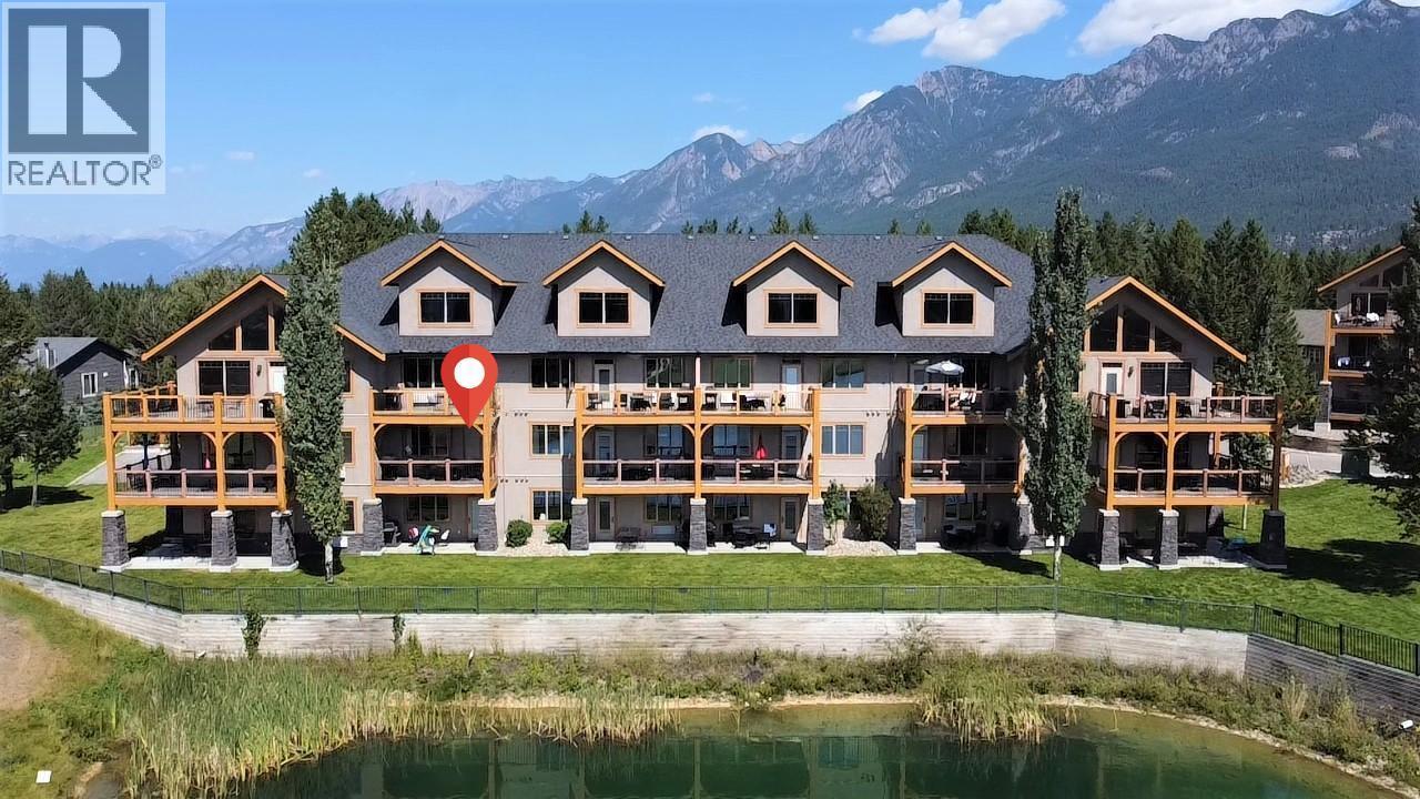 800 Bighorn Boulevard Unit# 825 E, Radium Hot Springs, BC - Outdoor With Body Of Water With Facade
