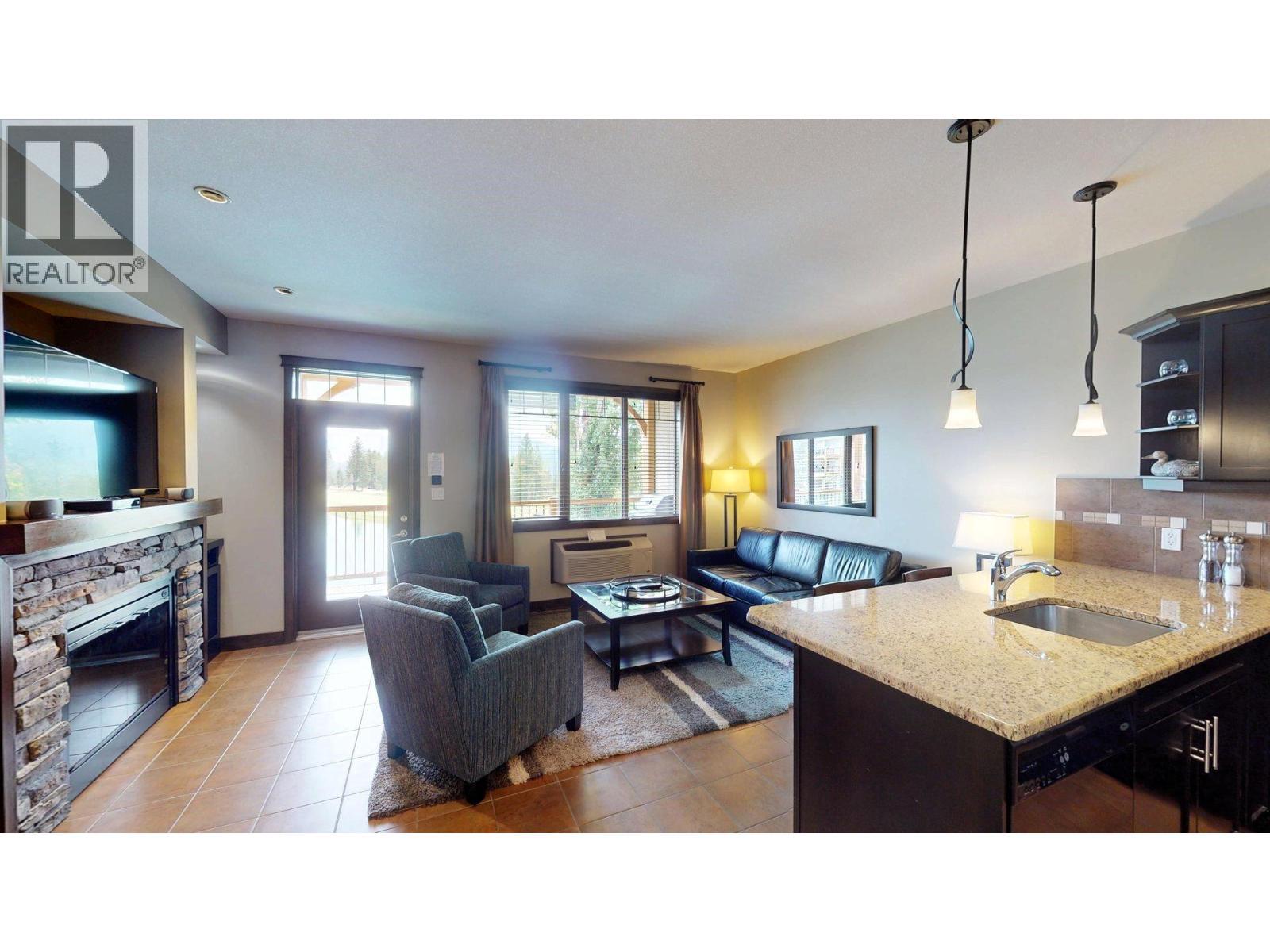 800 Bighorn Boulevard Unit# 825 E, Radium Hot Springs, BC - Indoor With Fireplace