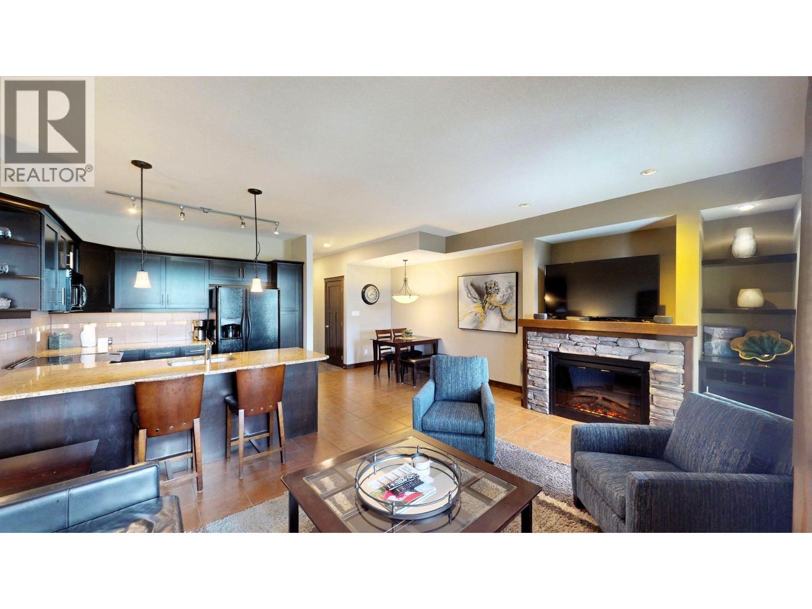 800 Bighorn Boulevard Unit# 825 E, Radium Hot Springs, BC - Indoor Photo Showing Living Room With Fireplace