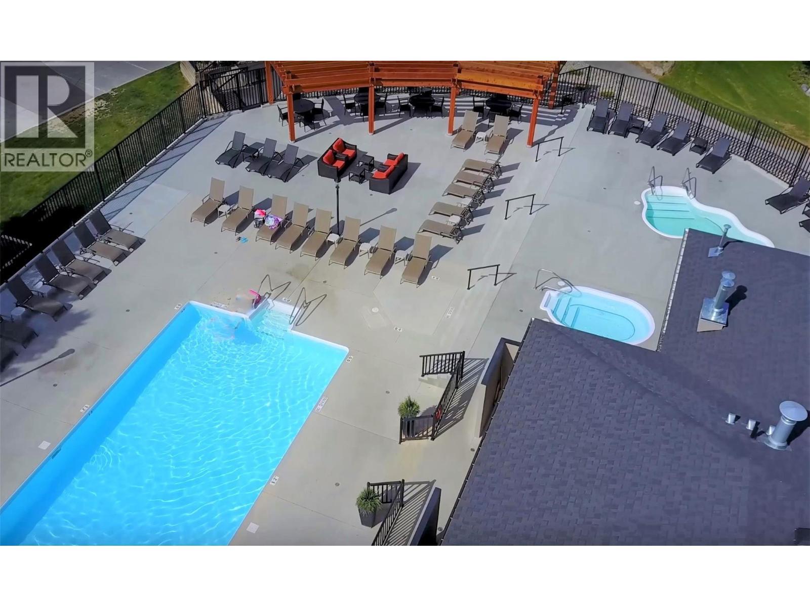 800 Bighorn Boulevard Unit# 825 E, Radium Hot Springs, BC - Outdoor With In Ground Pool With View