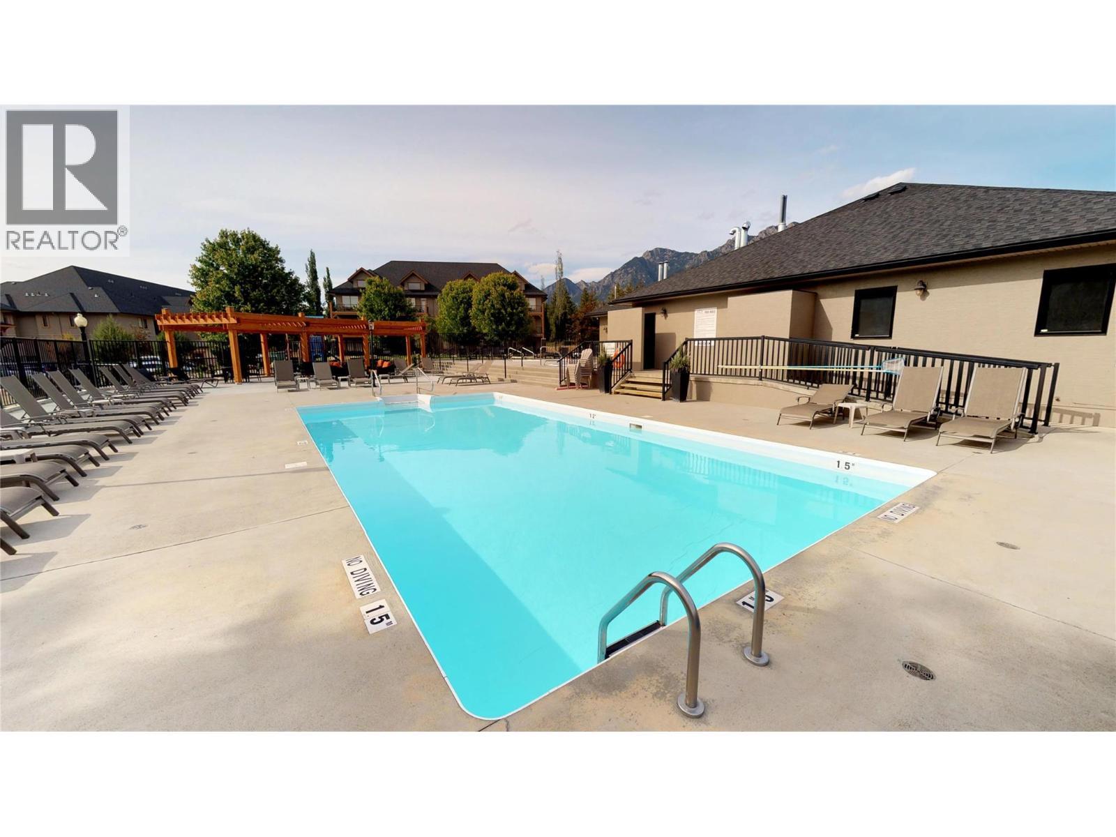 800 Bighorn Boulevard Unit# 825 E, Radium Hot Springs, BC - Outdoor With In Ground Pool