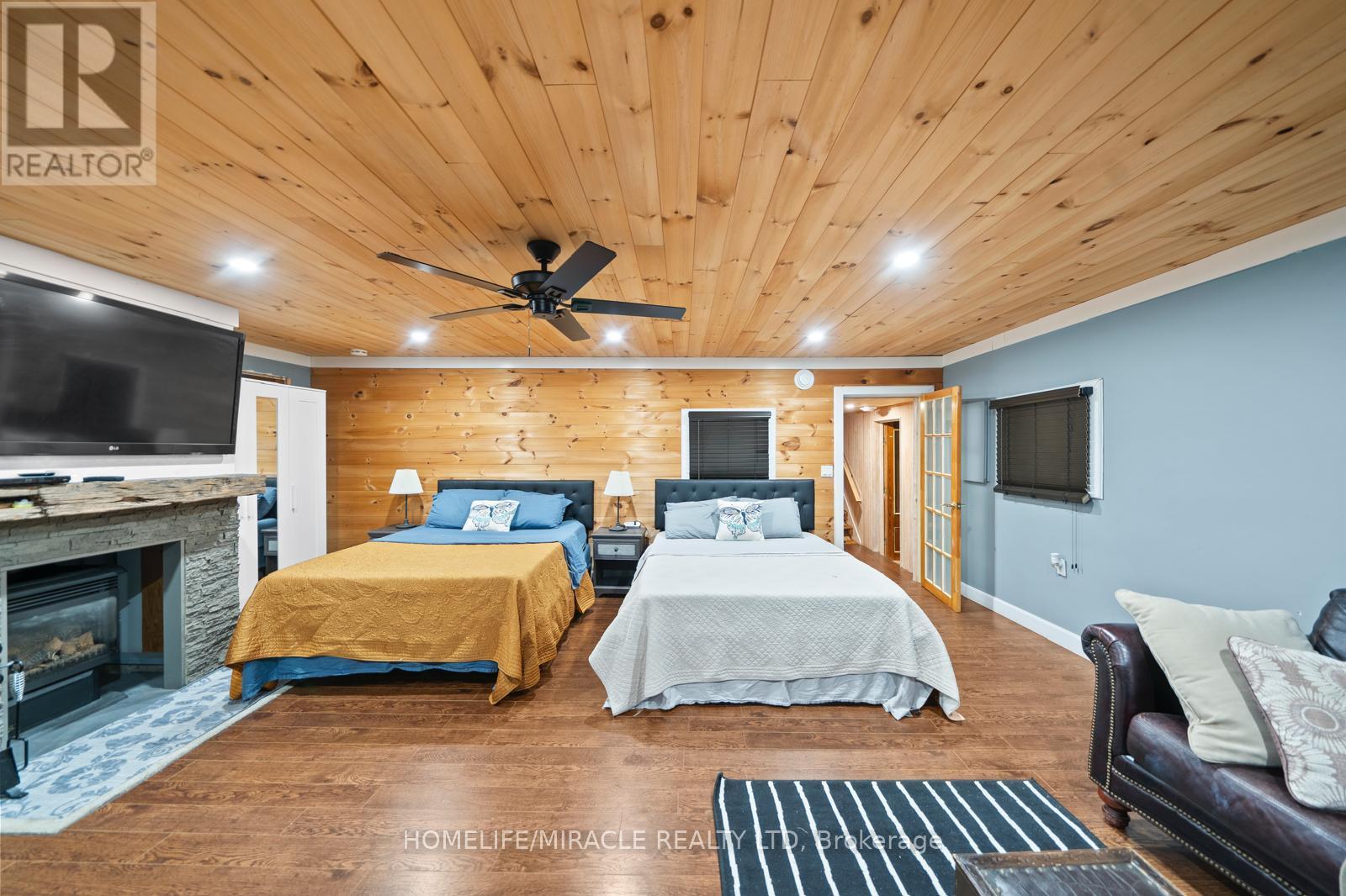 11278 Loyalist Parkway, Prince Edward County, ON - Indoor Photo Showing Bedroom With Fireplace