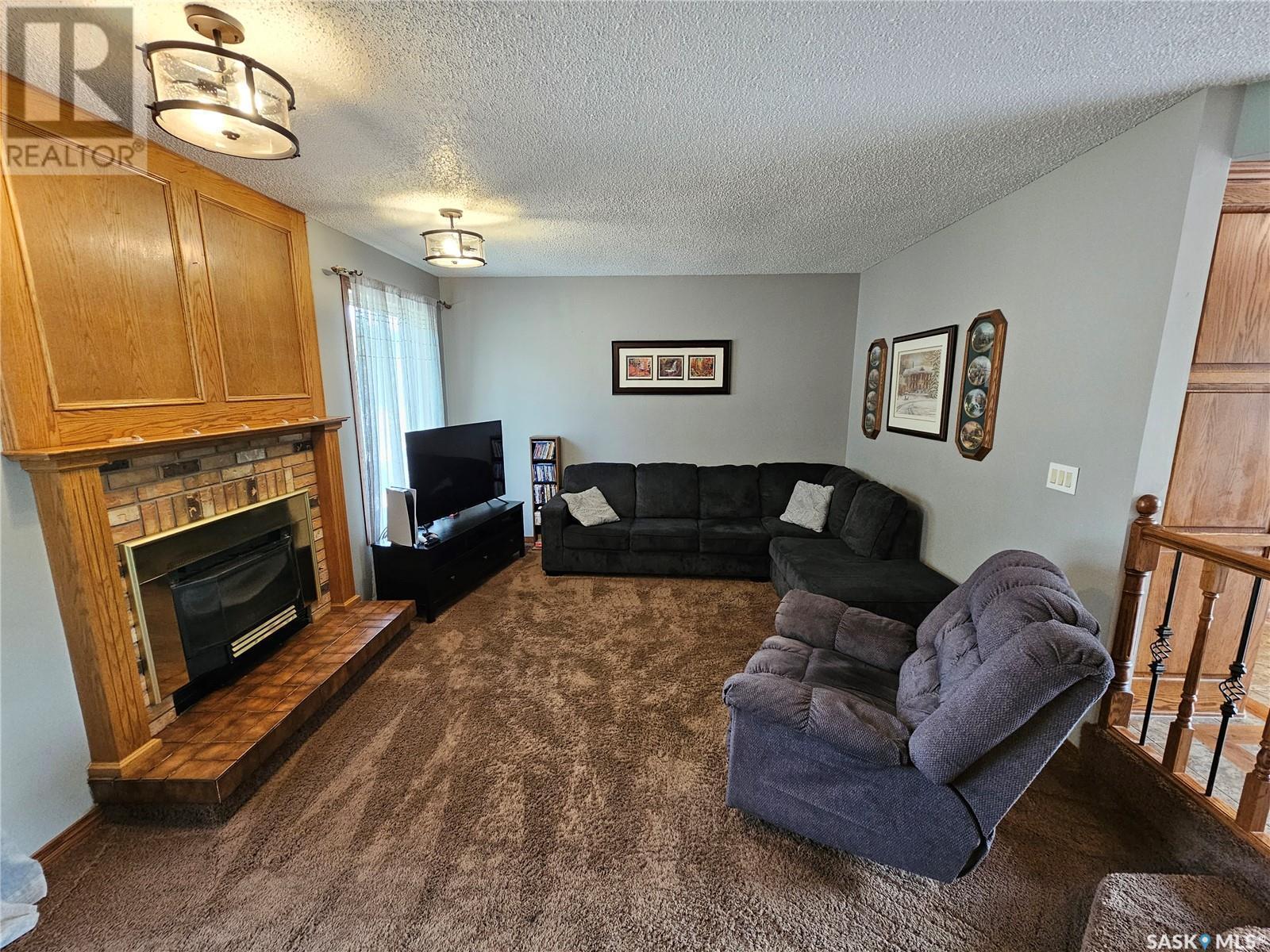 206 West 1St Street, Alida, SK - Indoor Photo Showing Living Room With Fireplace