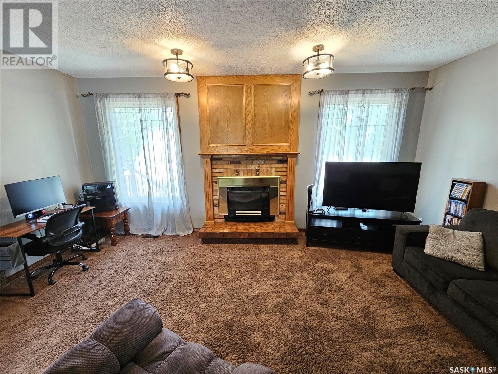 206 West 1St Street, Alida, SK - Indoor Photo Showing Living Room With Fireplace
