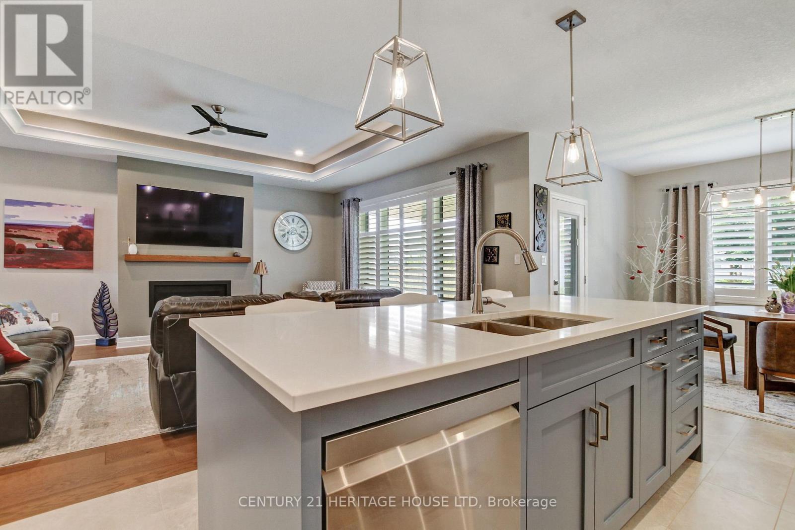184 Kettle Creek Drive, Central Elgin (Belmont), ON - Indoor Photo Showing Kitchen With Fireplace With Double Sink