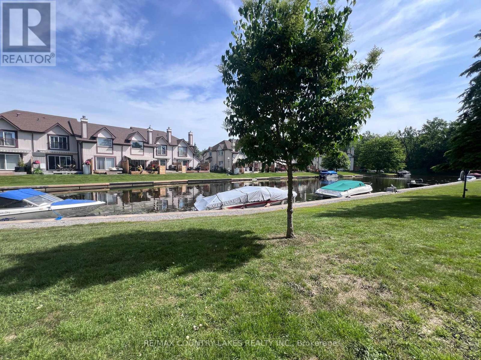 Canal View from Patio - 4 - 11 Laguna Parkway, Ramara, ON - Outdoor With In Ground Pool