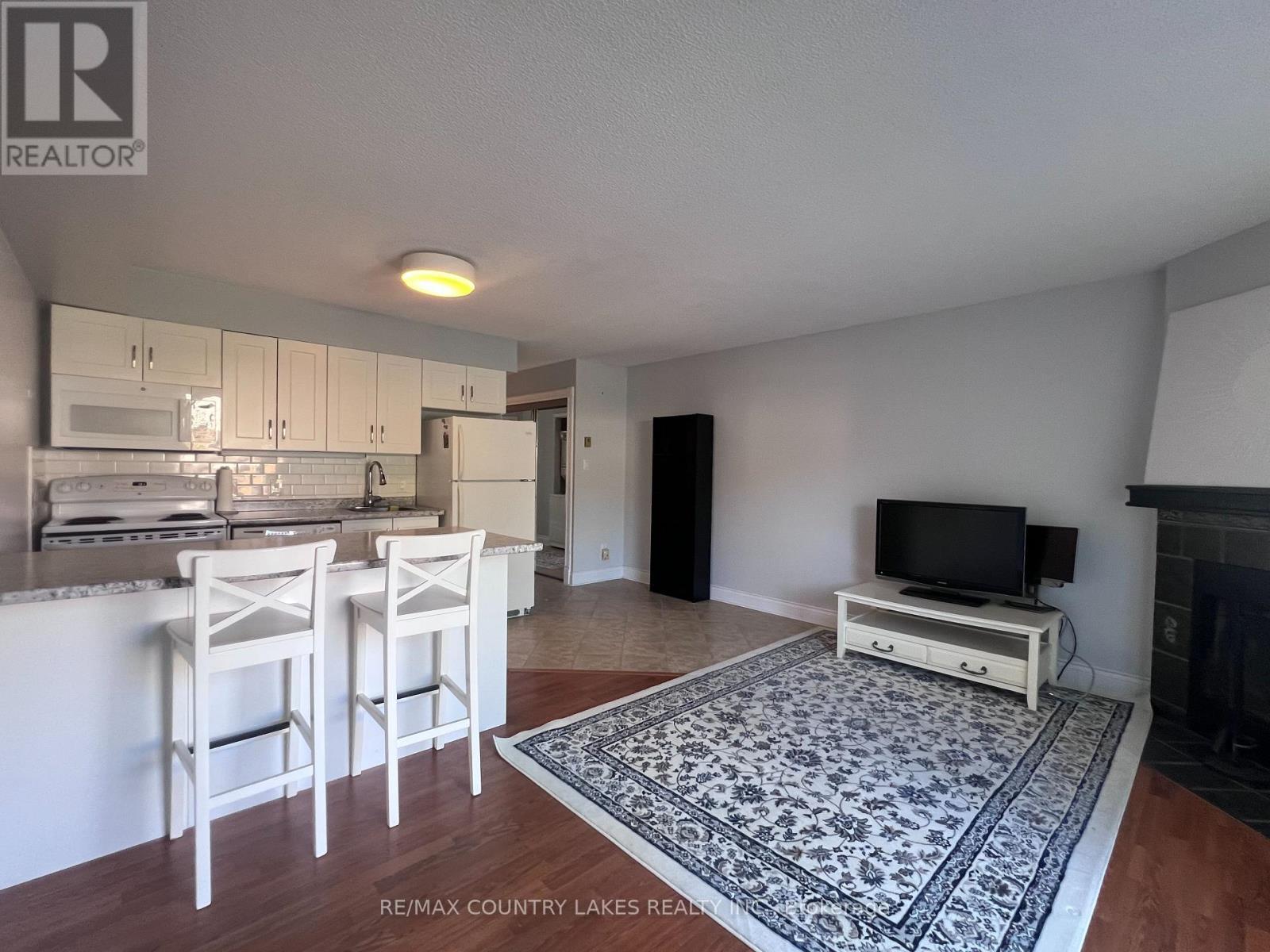 4 - 11 Laguna Parkway, Ramara, ON - Indoor With Fireplace