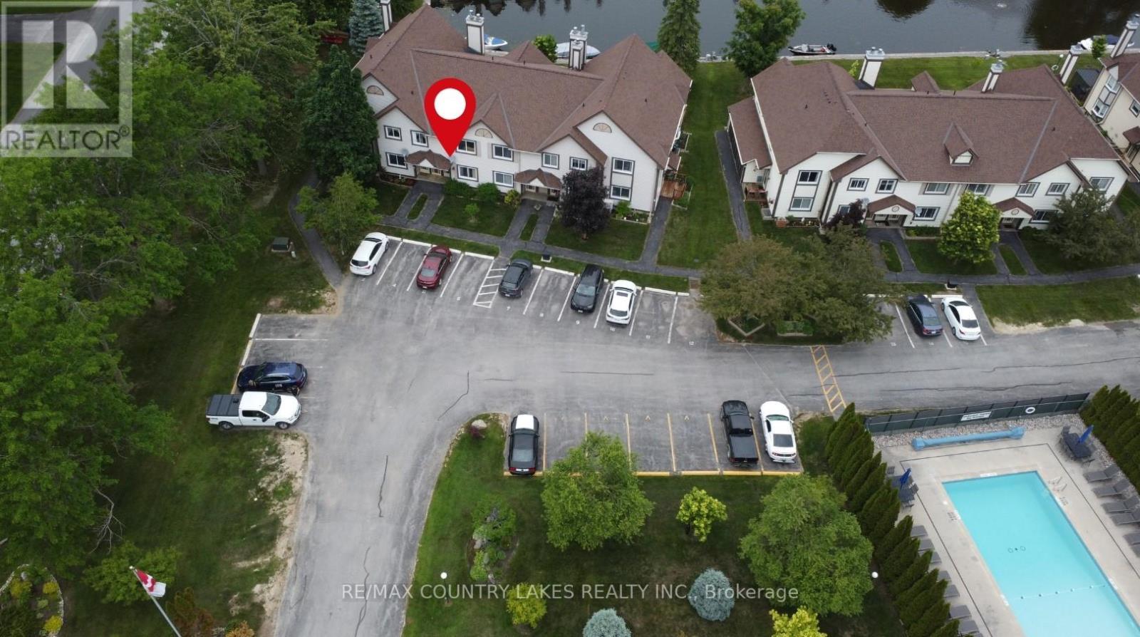 Front Aerial - 4 - 11 Laguna Parkway, Ramara, ON - Outdoor With In Ground Pool