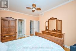 Primary bedroom view of ensuite and walk in closet -