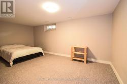 Spare bedroom with carpet -