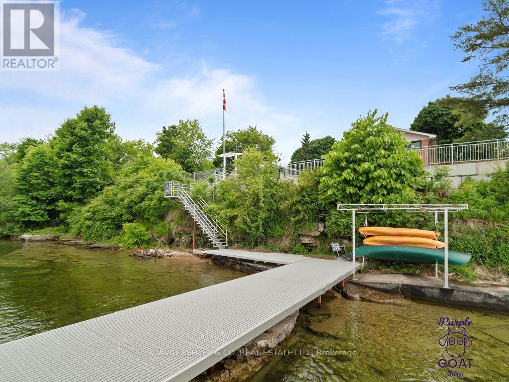 Gorgeous entertaining dock and waterfront - 1,2,3,4,5 - 809-811 Hilmor Terrace S, Elizabethtown-Kitley, ON - Outdoor With Body Of Water