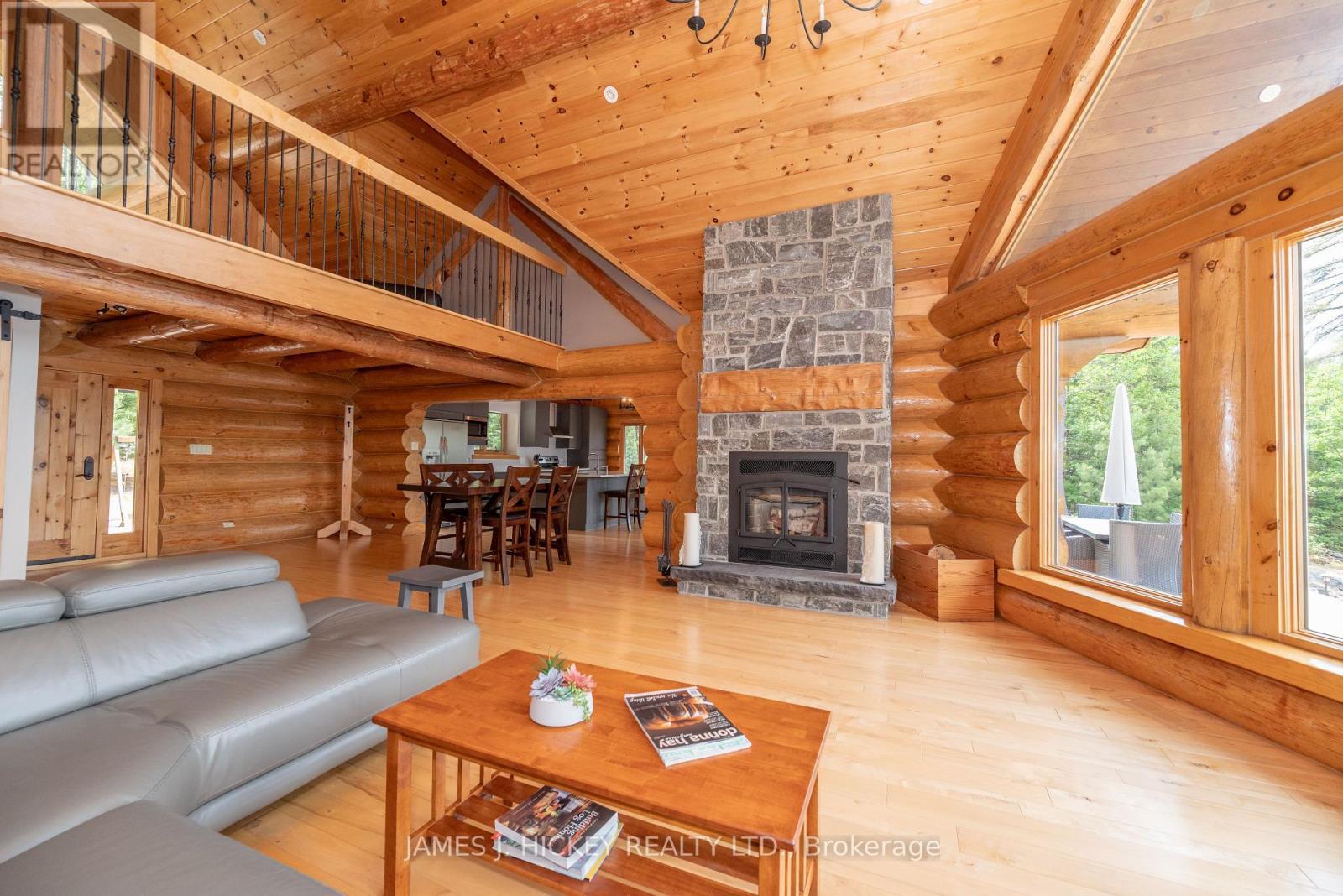 276 Colton Creek Road, Head, Clara And Maria, ON - Indoor Photo Showing Living Room With Fireplace