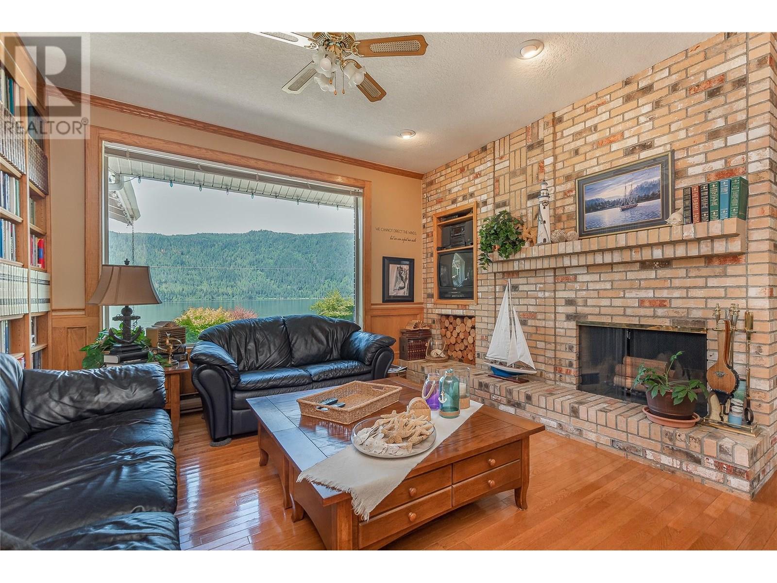 9178 Clancy Frontage Road, Mara, BC - Indoor Photo Showing Living Room With Fireplace