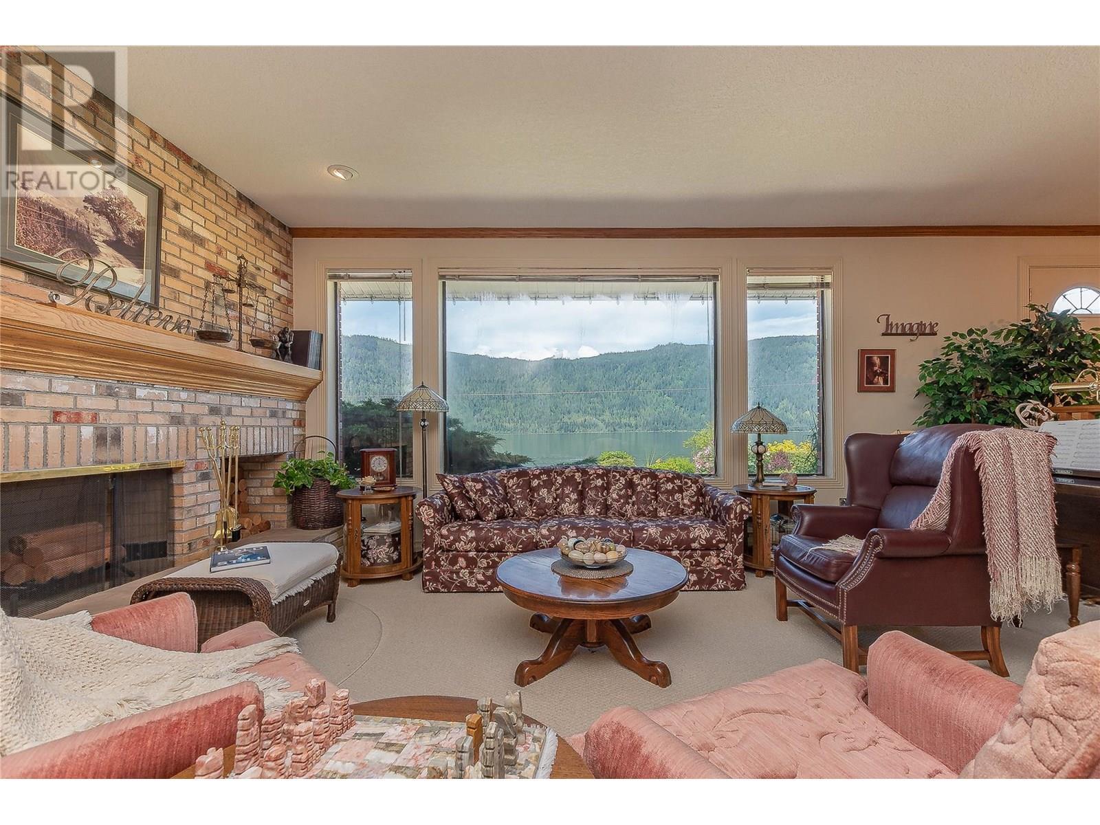 9178 Clancy Frontage Road, Mara, BC - Indoor Photo Showing Living Room With Fireplace