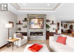 Linear Gas Fireplace, Built in Cabinets, Floating Shelves, Coffered Ceiling, Large Windows, View -